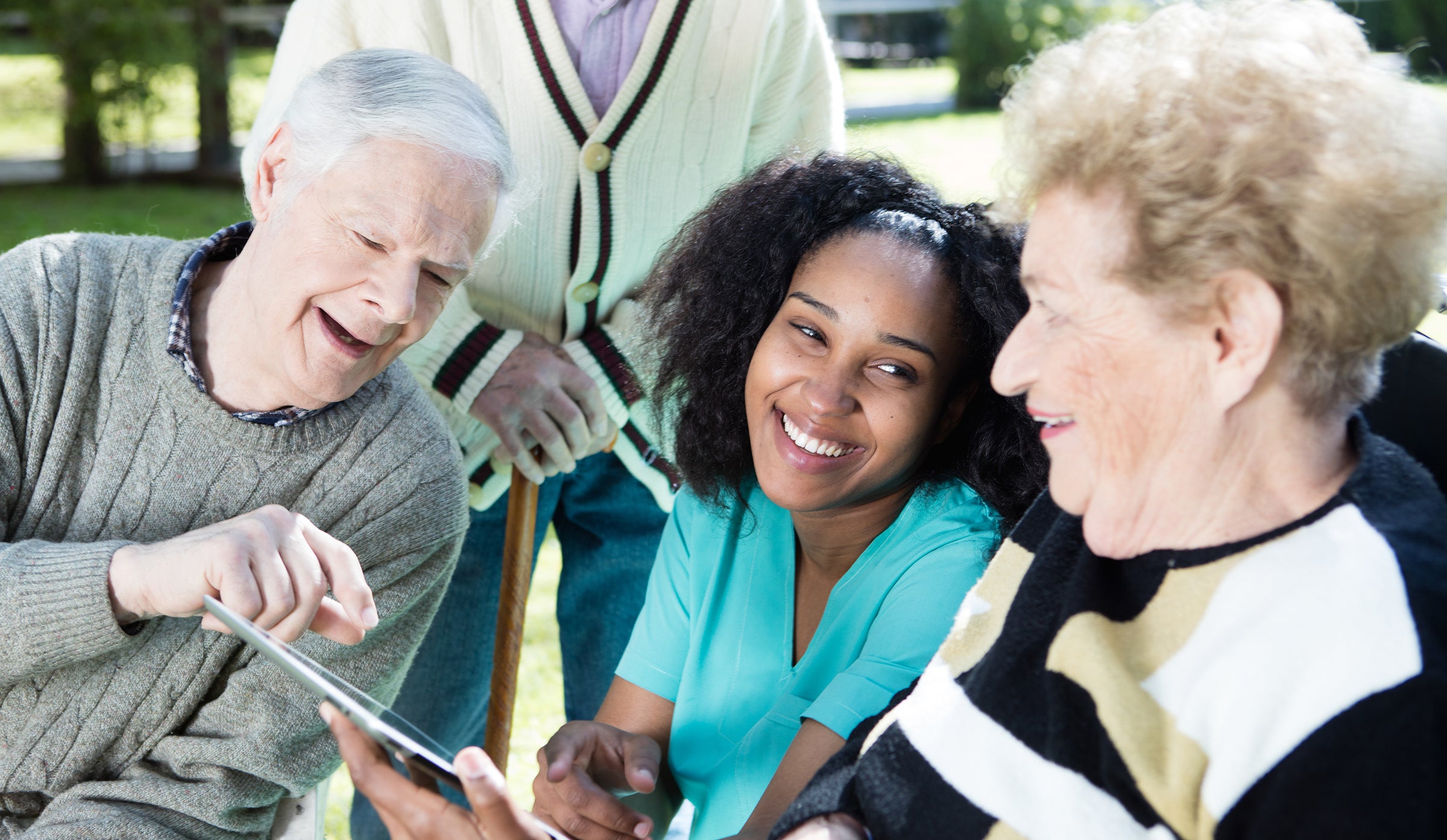 Provider looking at online information with two community members