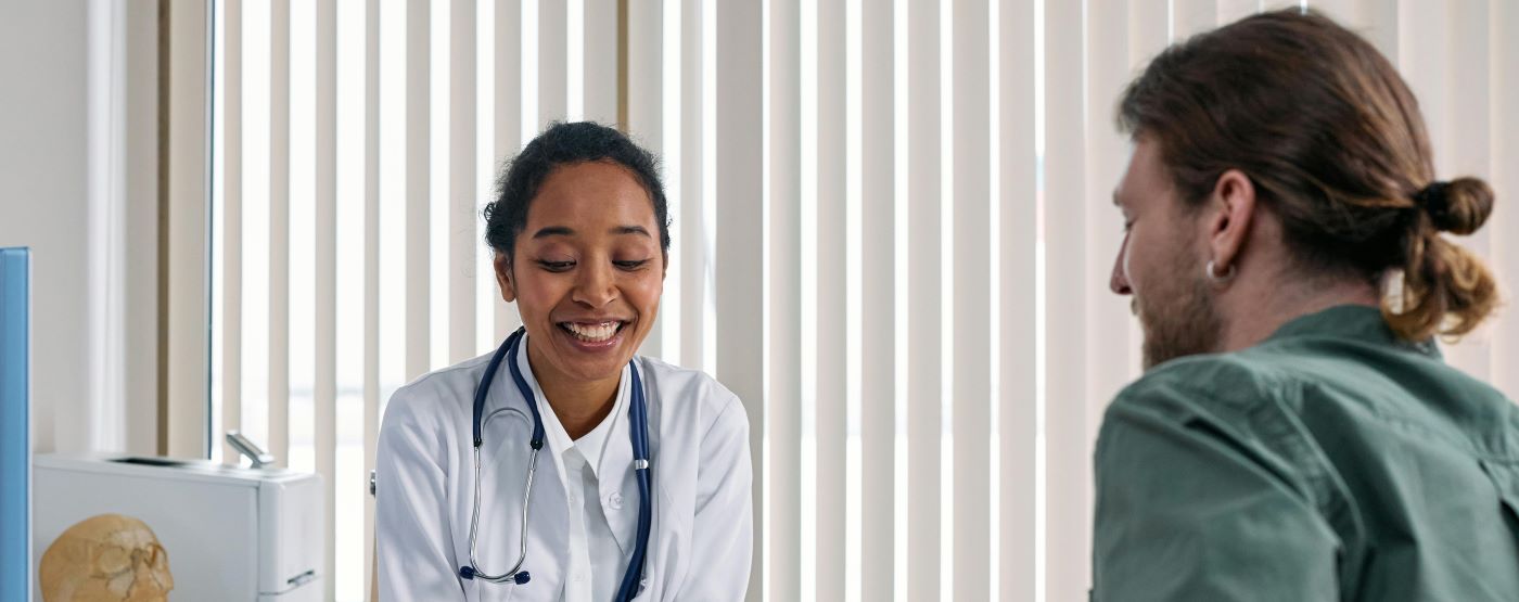 Physician talking with patient