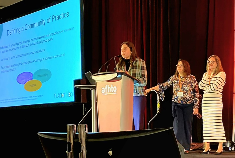 Dr. Melody Wyslobicky presenting, Ana Khrokova and Dr. Anna Chavlovski at the AFHTO in October 2024
