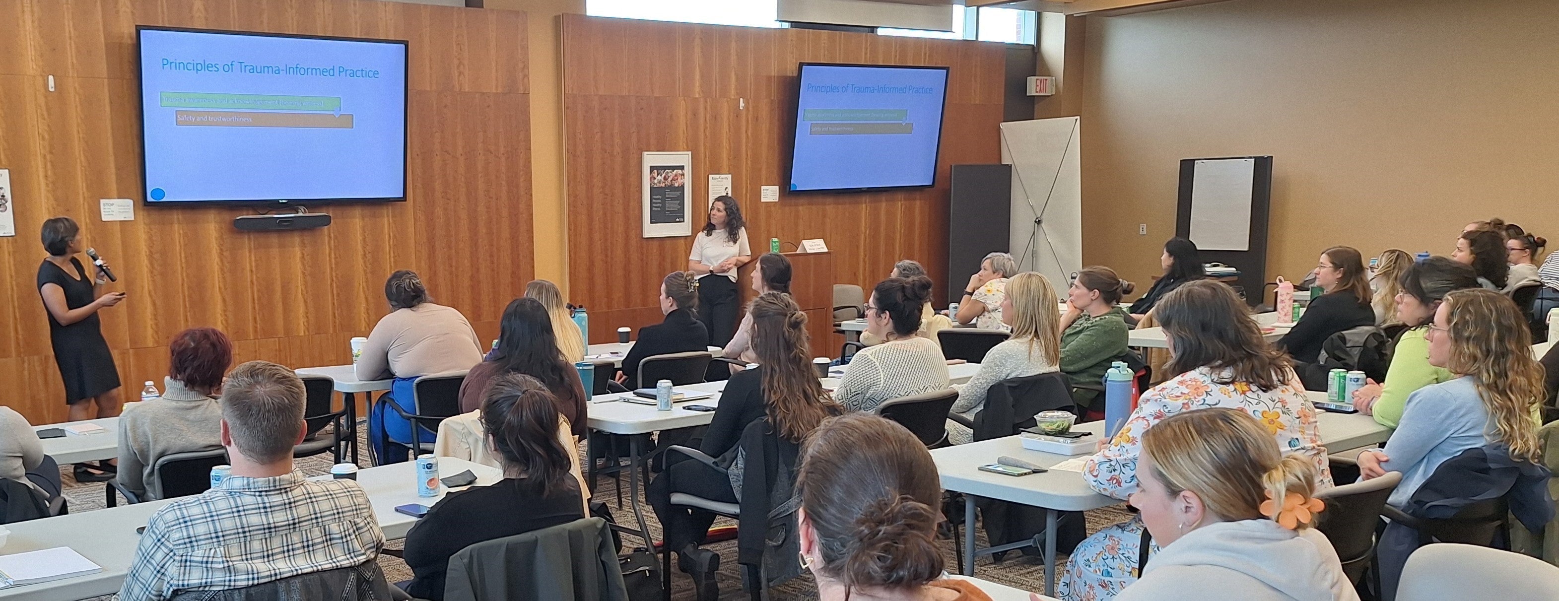 Dr. Patel and Dr. Rowlan presenting at Trauma-informed care session